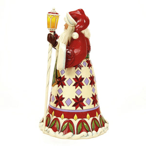 Spreading Christmas Cheer Santa holding Cardinal