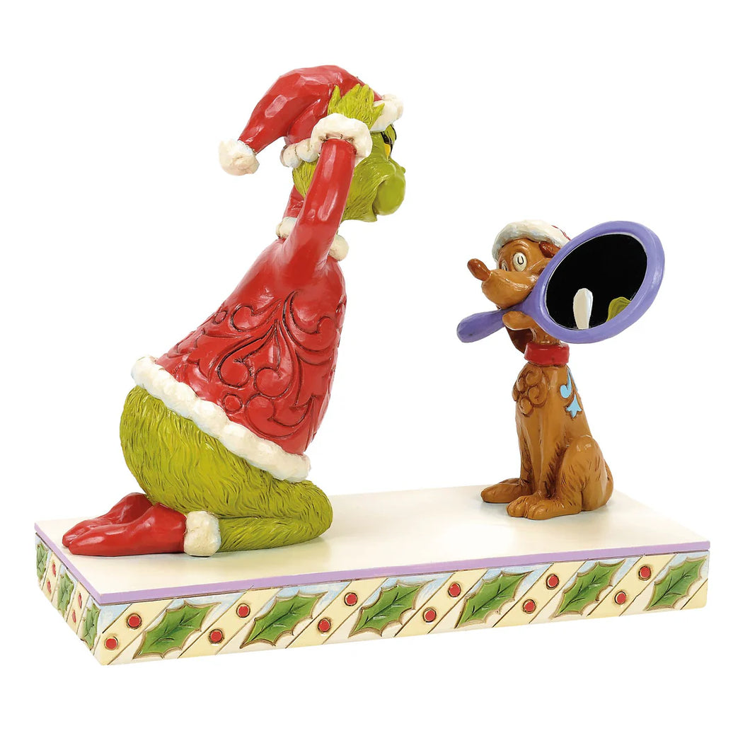Max Holding a Mirror for the Grinch